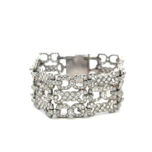 11.50 CARAT ROUND BRILLIANT G VS DIAMOND 18 KARAT WHITE GOLD LINK BRACELET: 11.50 CARAT ROUND BRILLIANT G VS DIAMOND 18 KARAT WHITE GOLD LINK BRACELET Title: This exquisite vintage wide-link bracelet is drenched in brilliance, showcasing an impressive 11.50 carats of G-color,