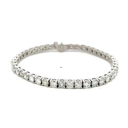 14 KARAT WHITE GOLD TENNIS BRACELET WITH 9.53 CARAT ROUND H-VS DIAMONDS: 14 KARAT WHITE GOLD TENNIS BRACELET WITH 9.53 CARAT ROUND H-VS DIAMONDS Detailed Description: 9.53 Carat Round Diamonds H VS Elevate your elegance with this stunning 14 Karat White Gold Tennis Bracele