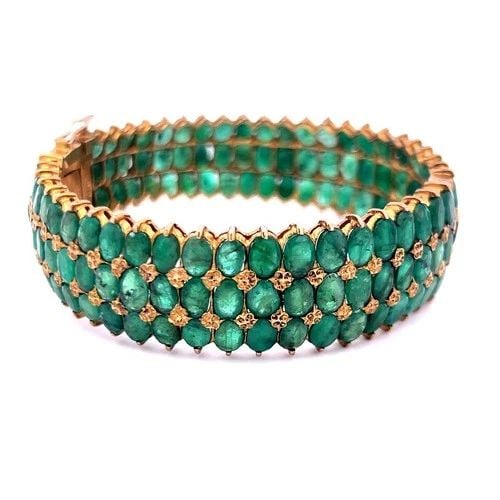 18 KARAT YELLOW GOLD OVAL 75 CARAT JADE BANGLE BRACELET 7 INCH 35.40 GRAMS: 18 KARAT YELLOW GOLD OVAL 75 CARAT JADE BANGLE BRACELET 7 INCH 35.40 GRAMS Video: Video Link Detailed Description: Elevate your elegance with this stunning vintage bangle, crafted from 18 Karat yellow
