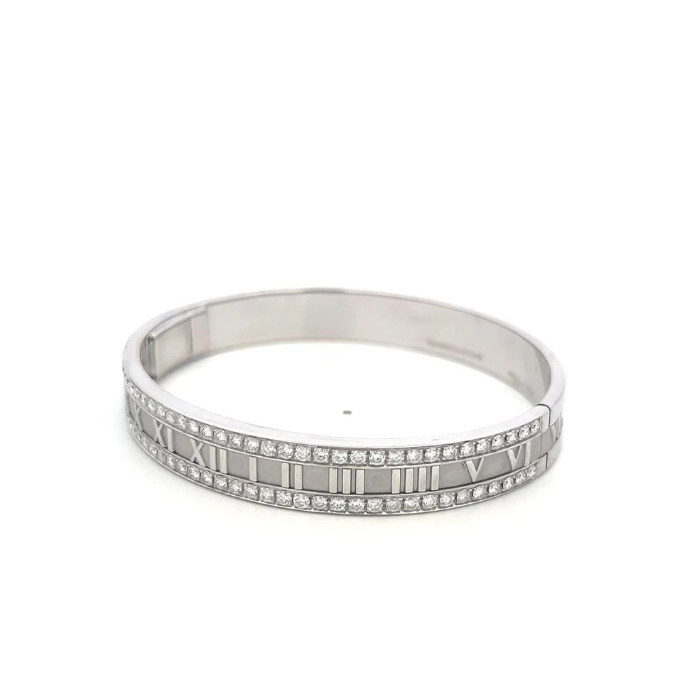 TIFFANY & CO 18K WHITE GOLD ATLAS BANGLE BRACELET WITH 2.5 CARAT ROUND DIAMONDS: TIFFANY & CO 18K WHITE GOLD ATLAS BANGLE BRACELET WITH 2.5 CARAT ROUND DIAMONDS TIFFANY & CO 18K WHITE GOLD ATLAS BANGLE BRACELET WITH 2.5 CARAT ROUND DIAMONDS PRODUCT DESCRIPTION Designer: Tiffany & 