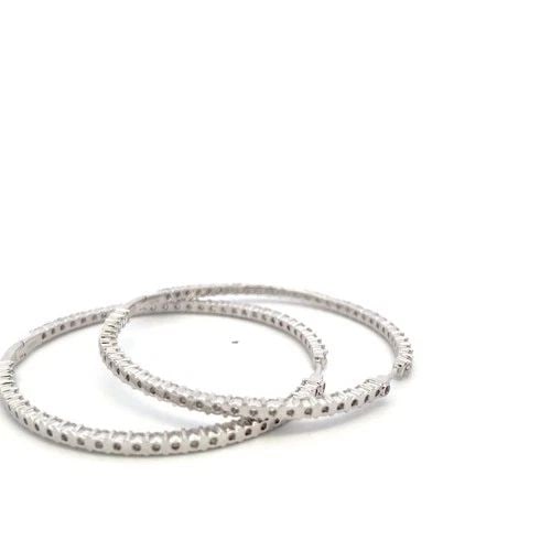 VINTAGE 18K WHITE GOLD HOOP EARRINGS WITH 7 CARAT ROUND G-VS DIAMONDS: VINTAGE 18K WHITE GOLD HOOP EARRINGS WITH 7 CARAT ROUND G-VS DIAMONDS Detailed Description: Elevate your elegance with these luxurious hoop earrings, crafted from 18 Karat White Gold. Adorned with an 