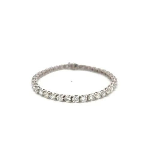 VINTAGE 18K WHITE GOLD TENNIS BRACELET WITH 7.6 CARAT ROUND H-SI DIAMONDS: VINTAGE 18K WHITE GOLD TENNIS BRACELET WITH 7.6 CARAT ROUND H-SI DIAMONDS Video: Video Link Detailed Description: Elevate your style with this striking tennis bracelet crafted from 18 Karat white gold