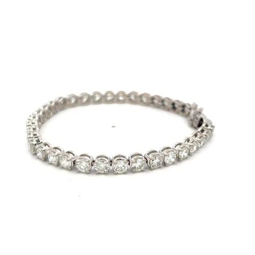 7.00 CARAT H VS DIAMOND TENNIS BRACELET 14K WHITE GOLD VINTAGE ESTATE: 7.00 CARAT H VS DIAMOND TENNIS BRACELET 14K WHITE GOLD VINTAGE ESTATE Title: This classic 7.00 carat diamond tennis bracelet is crafted in solid 14 karat white gold and showcases timeless elegance wit