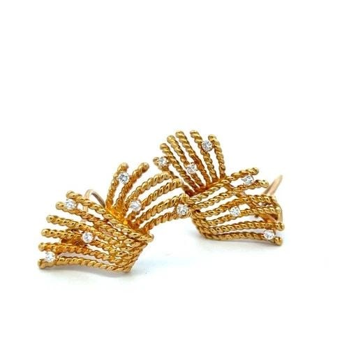 TIFFANY & CO VINTAGE 18K YG CLIP-ON EARRINGS WITH 0.56 CARAT ROUND DIAMONDS: TIFFANY & CO VINTAGE 18K YG CLIP-ON EARRINGS WITH 0.56 CARAT ROUND DIAMONDS Designer: Tiffany & Co Detailed Description: These vintage Tiffany & Co clip-on earrings radiate elegance with their 18 kara