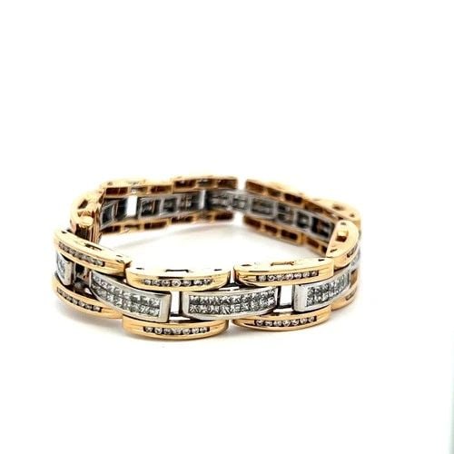 14 KARAT TWO-TONE GOLD LINK BRACELET WITH 6.26 CARAT ROUND AND PEAR DIAMONDS: 14 KARAT TWO-TONE GOLD LINK BRACELET WITH 6.26 CARAT ROUND AND PEAR DIAMONDS Detailed Description: Elevate your style with this vintage two-tone gold bracelet, intricately designed with a stunning arr
