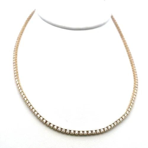 VINTAGE 14K YELLOW GOLD TENNIS NECKLACE WITH 6 CARAT ROUND I VS DIAMONDS: VINTAGE 14K YELLOW GOLD TENNIS NECKLACE WITH 6 CARAT ROUND I VS DIAMONDS Detailed Description: In the shimmering glow of candlelight or the gentle rays of dawn, this vintage diamond tennis necklace ca