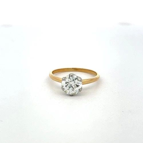 1.50CT L SI1 ROUND DIAMOND 18K GOLD & PLATINUM VINTAGE ENGAGEMENT RING: 1.50CT L SI1 ROUND DIAMOND 18K GOLD & PLATINUM VINTAGE ENGAGEMENT RING Title: This timeless vintage engagement ring features a striking 1.50 carat circular brilliant cut diamond, graded L color and SI