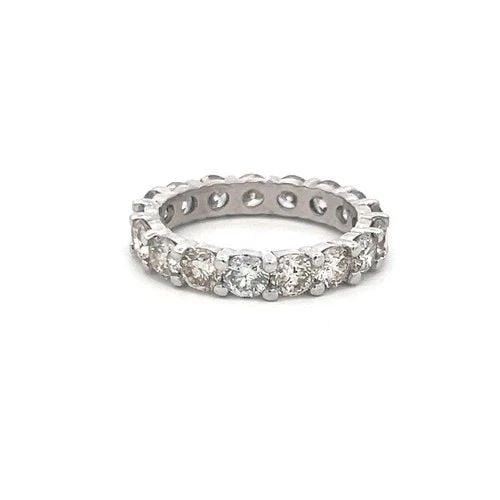 VINTAGE PLATINUM ETERNITY BAND RING WITH 4.5 CARAT ROUND DIAMONDS SIZE 8: VINTAGE PLATINUM ETERNITY BAND RING WITH 4.5 CARAT ROUND DIAMONDS SIZE 8 Video: Video Link Detailed Description: 4.5 Carat Diamond, I-Si, Size 8 Elevate your elegance with this stunning platinum etern