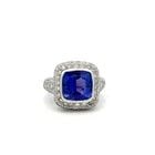 18K WHITE GOLD COCKTAIL RING WITH 7 CARAT TANZANITE 3.5 CARAT DIAMONDS SIZE 6.5: 18K WHITE GOLD COCKTAIL RING WITH 7 CARAT TANZANITE 3.5 CARAT DIAMONDS SIZE 6.5 Detailed Description: Elevate your style with this striking 18 Karat white gold cocktail ring. A vibrant 7 carat tanzani