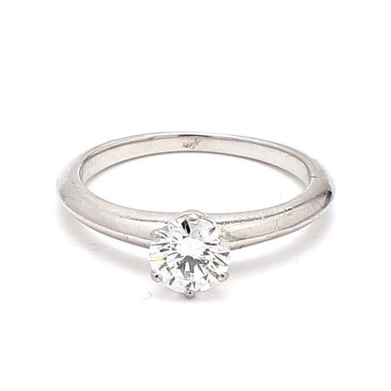 TIFFANY & CO.. 0.70 CARAT G-VS1 DIAMOND PLATINUM ENGAGEMENT RING: TIFFANY & CO.. 0.70 CARAT G-VS1 DIAMOND PLATINUM ENGAGEMENT RING Tiffany & Co. Tiffany & Co.. 0.70 Carat G-VS1 Diamond Platinum Engagement Ring Details Department Unisex Adults Main Stone Diamond Meta