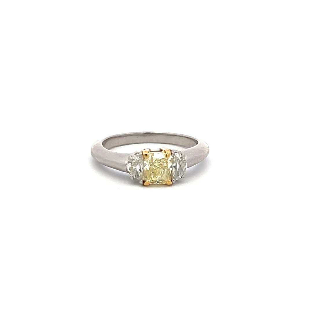 1.30 CARAT RADIANT FANCY YELLOW AND HALF MOON DIAMOND 18K GLD-P THREE STONE RING: 1.30 CARAT RADIANT FANCY YELLOW AND HALF MOON DIAMOND 18K GLD-P THREE STONE RING Title: 1.30 Carat Radiant Cut Fancy light yellow VS1 and Half Moon Shape H VS Diamond 18 Karat Two Tone Gold/Platinum T
