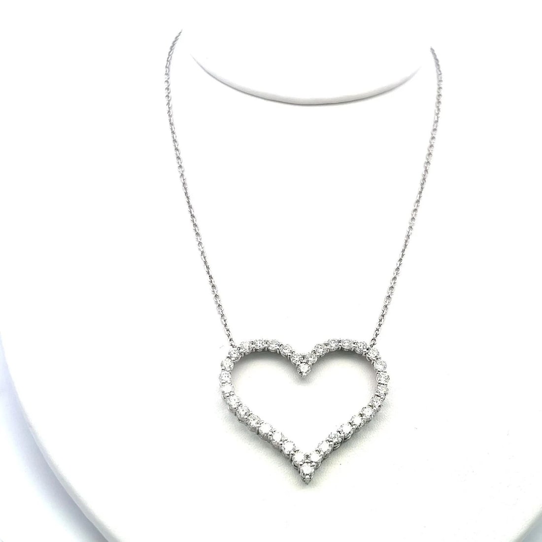 14K WHITE GOLD HEART PENDANT NECKLACE WITH 3.5 CARAT ROUND I-SI DIAMONDS: 14K WHITE GOLD HEART PENDANT NECKLACE WITH 3.5 CARAT ROUND I-SI DIAMONDS Detailed Description: 3.5 Carat Diamond Heart Pendant, 14K White Gold, 16 In Chain DESCRIPTION: Elevate your elegance with this