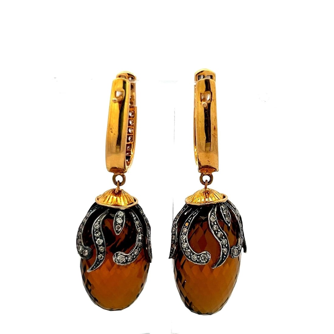 14K YG DANGLING EARRINGS WITH 1.2 CARAT DIAMONDS AND 14.5 X24.5 MM SMOKEY QUARTZ: 14K YG DANGLING EARRINGS WITH 1.2 CARAT DIAMONDS AND 14.5 X24.5 MM SMOKEY QUARTZ Detailed Description: Elevate your style with these striking vintage dangling earrings. Crafted from 14 karat yellow go