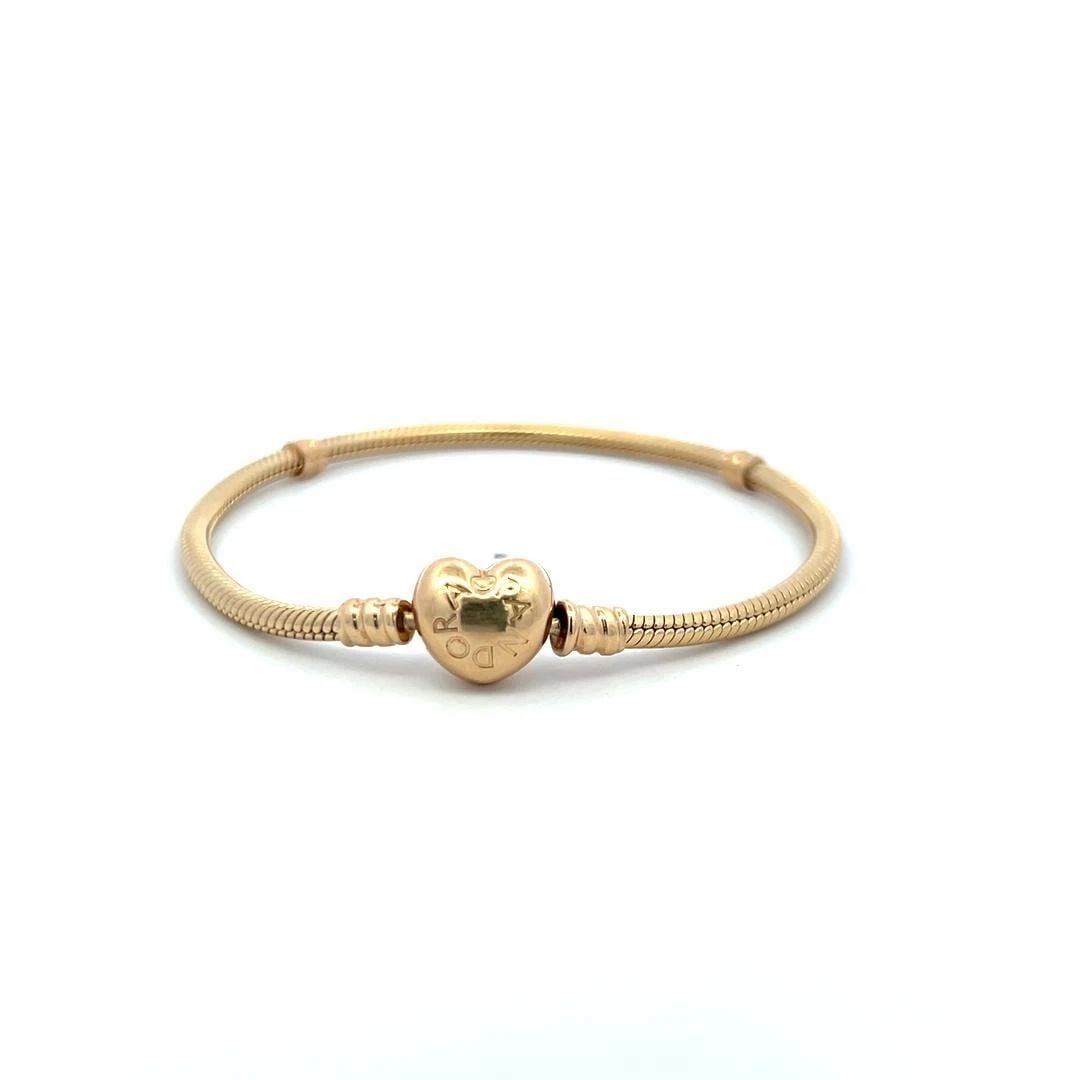 PANDORA 19.50 GRAMS 7.75 INCH 14 KARAT YELLOW GOLD CHAIN BRACELET: PANDORA 19.50 GRAMS 7.75 INCH 14 KARAT YELLOW GOLD CHAIN BRACELET PRODUCT DESCRIPTION Designer: Pandora Title: Pandora 14 Karat Yellow Gold Chain Bracelet Style: Chain Metal: 14 Karat Yellow Gold Dime