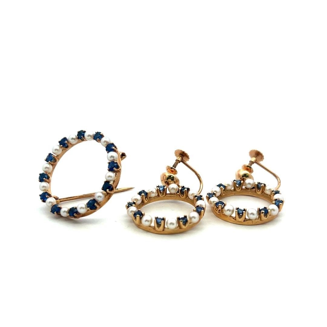 14K YG PIN BROOCH & DANGLING EARRINGS SET WITH 1.04 CARAT SAPPHIRE AND PEARLS: 14K YG PIN BROOCH & DANGLING EARRINGS SET WITH 1.04 CARAT SAPPHIRE AND PEARLS PRODUCT DESCRIPTION Detailed Description: Elevate your style with this striking vintage brooch and earring set crafted in 
