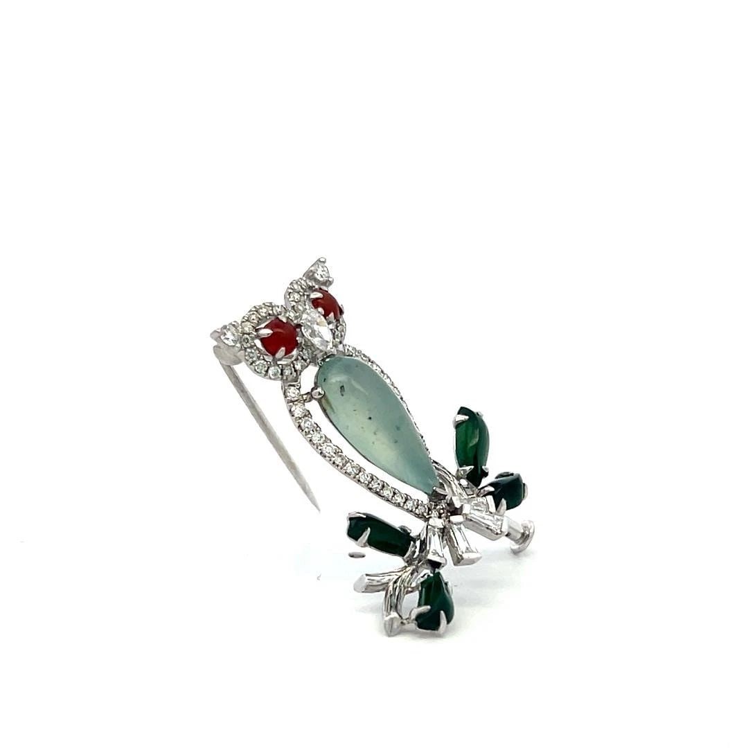 VINTAGE 18K WG OWL PIN BROOCH WITH 0.69 CARAT MULTI-SHAPE DIAMONDS & JADE: VINTAGE 18K WG OWL PIN BROOCH WITH 0.69 CARAT MULTI-SHAPE DIAMONDS & JADE Video: Video Link Detailed Description: Elevate your style with this enchanting vintage owl pin brooch, masterfully crafted in