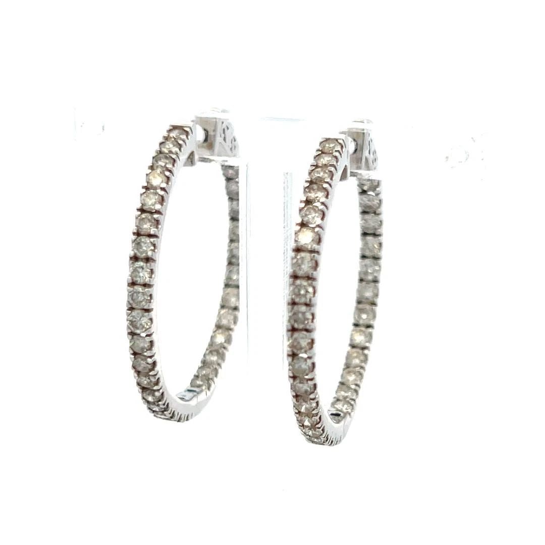 1.50 CARAT ROUND BRILLIANT J VS DIAMOND 14 KARAT WHITE GOLD HOOP EARRINGS: 1.50 CARAT ROUND BRILLIANT J VS DIAMOND 14 KARAT WHITE GOLD HOOP EARRINGS Title: 1.50 Carat Round Brilliant J VS Diamond 14 Karat White Gold Hoop Earrings Style: Hoop Metal: 14 Karat White Gold Gemsto