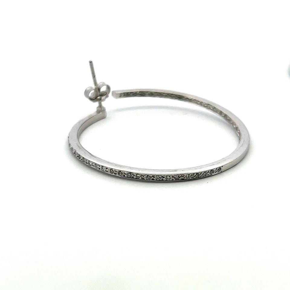0.81 CARAT CIRCULAR BRILLIANT CUT I SI1 DIAMOND 18K WG HOOP EARRINGS: 0.81 CARAT CIRCULAR BRILLIANT CUT I SI1 DIAMOND 18K WG HOOP EARRINGS 0.81 Carat Circular Brilliant Cut I SI1 Diamond 18 Karat White Gold Hoop Earrings 18k Details Department Unisex Adults Main Stone D
