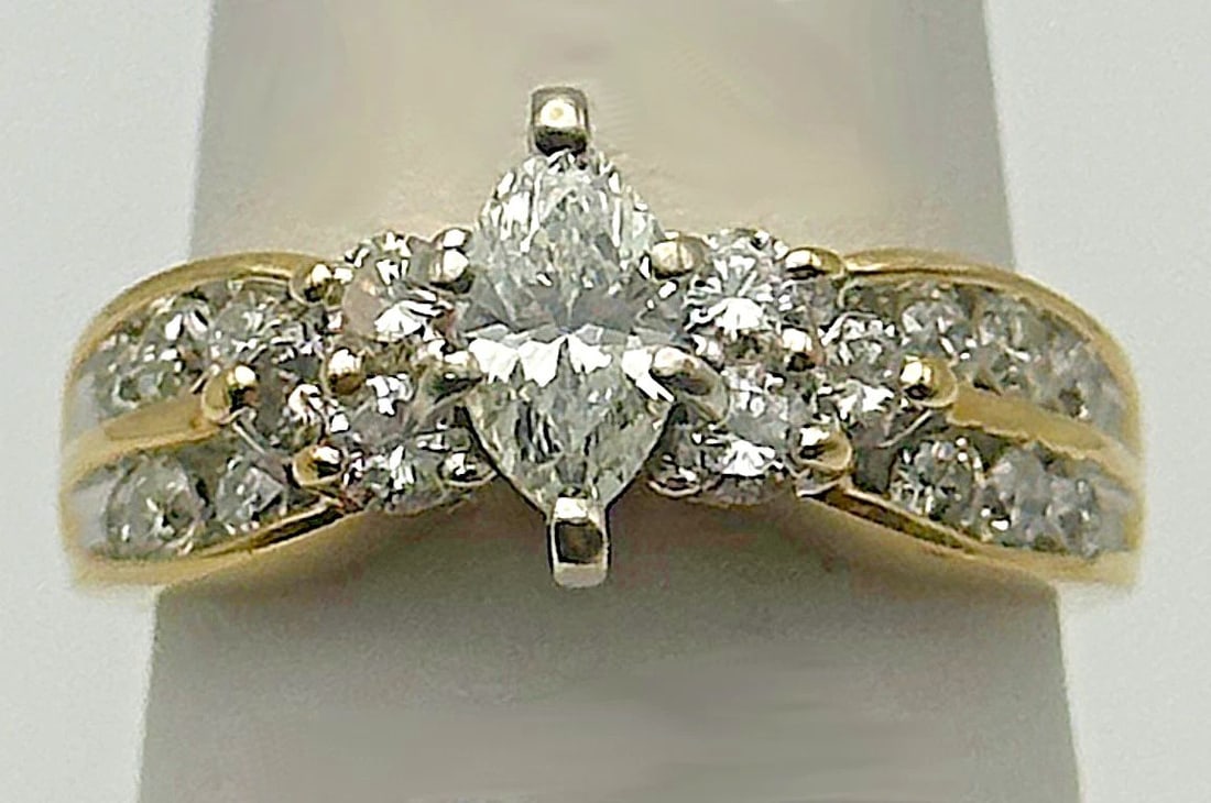 14K GOLD RING, 1.20CTS DIAMONDS, 0.50CT MARQUISE CENTER ( SIZE: 7.75 ) 6.1G: 14K YELLOW GOLD RING WITH DIAMONDS MARQUISE CENTER (SIZE 7.75) 14k Yellow Gold Ring with Diamonds You are bidding on a 14k Yellow Gold Ring with Diamonds. Ring has been fully restored by our in house 