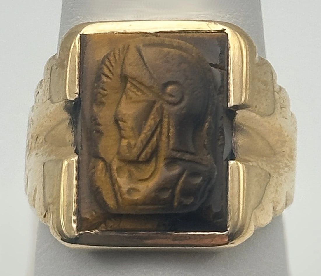 10K GOLD RING SET WITH CAMEO TIGER'S EYE SIZE: 9.5 7 GRAMS: TIGER'S EYE, CAMEO RING 10K GOLD Tiger eye, Cameo Ring 10k Gold You are bidding on a pre-owned Tiger's eye, Cameo Ring 10k Gold. The ring is in excellent condition. Features 10k yellow gold, tiger eye