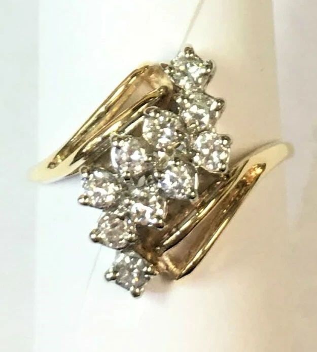 14K GOLD WOMAN'S RING WITH 0.80CTS NATURAL DIAMONDS CLUSTER (SIZE: 9.75) 4.3G: 14K YELLOW GOLD WOMAN'S RING WITH DIAMONDS CLUSTER STYLE (SIZE: 9.75) 14k Yellow Gold Woman's Ring with Diamonds You are bidding on a 14k Yellow Gold Woman's Ring with Diamonds. The Ring has some mark