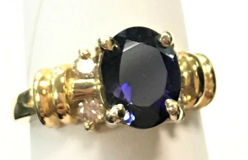 14K YELLOW GOLD RING WITH 1.46CT IOLITE AND 0.20CTW DIAMONDS (SIZE 6.75) 5.8G: 14K YELLOW GOLD RING WITH IOLITE CENTER STONE AND DIAMONDS (SIZE: 6.75) 14k Yellow Gold Ring with Iolite Center Stone and Diamonds You are bidding on a 14k Yellow Gold Ring with Iolite Center Stone an