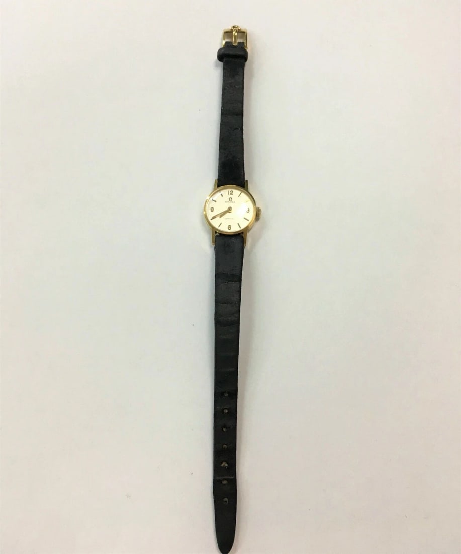 VINTAGE WOMAN'S CENTURY OMEGA 18K YELLOW GOLD WATCH (1 of 2)