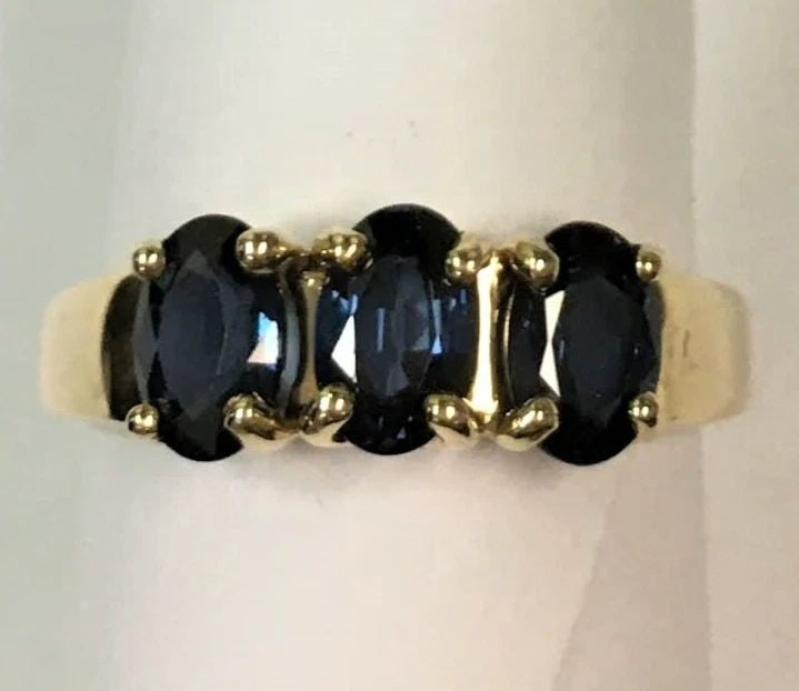 14K YELLOW GOLD RING WITH NATURAL SAPPHIRES (SIZE: 8.75) 3.8 GRAMS: 14k Yellow Gold Ring with Natural Sapphire You are bidding on a pre-owned 14k Yellow Gold Ring with Natural Sapphire. The piece has marks and scratches on it from being worn and used. They have been i