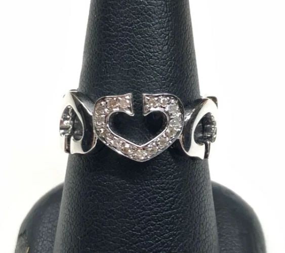 NEW 14K WHITE GOLD HEARTS AROUND RING WITH 0.10CTW DIAMONDS (SIZE 7.25) 4.2G: 14K WHITE GOLD HEART RING WITH DIAMONDS NEW 14k White Gold Heart Ring with Diamonds NEW You are bidding on a new with defects 14k White Gold Heart Ring with Diamonds. The ring has minor scuffs and scr