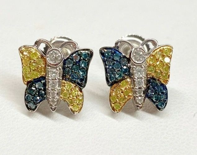 10K WHITE GOLD BUTTERFLY 1.00CTW YELLOW & BLUE DIAMOND EARRINGS 3.2G: 10K WHITE GOLD BUTTERFLY DIAMOND EARRINGS 10k White Gold Butterfly, Diamond Earrings You are bidding on a pre-owned 10k White Gold Butterfly, Diamond Earrings. The earrings has minor scuffs and scratc