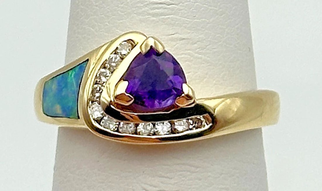 14K GOLD RING WITH AMETHYST, 0.25CTW DIAMONDS, OPAL INLAY (SIZE 6.5) 3.7 GRAMS: 14K YELLOW GOLD RING WITH AMETHYST, 0.25CTS OF DIAMONDS, OPAL INLAY SIZE: 6.5 14k Yellow Gold Ring with Amethyst, 0.25cts of Diamonds, Opal Inlay Condition: Used Material: 14k Yellow Gold Ring Size: 6