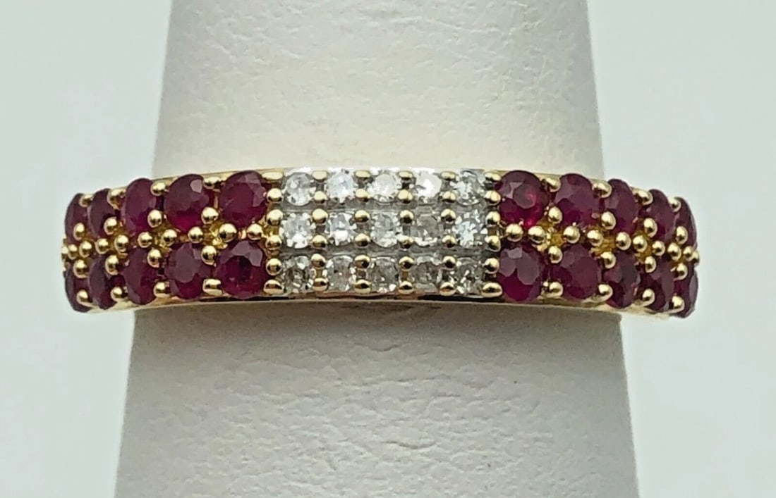 14K GOLD BAND WITH 1CTW NATURAL RUBIES AND 0.15CTW DIAMONDS (SIZE 7) 3.5 GRAM: 14K GOLD BAND WITH 1CT OF NATURAL RUBIES AND 0.15CTS OF DIAMONDS SIZE: 7 14k Gold Band with 1ct of Natural Rubies and 0.15cts of Diamonds Condition: Used Material: 14k Yellow Gold Ring Size: 7 Weight: