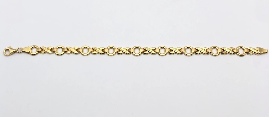 10K YELLOW GOLD ROUND AND X LINKED STYLE BRACELET ( 7.5 INCH ) 5.1G: 10K YELLOW GOLD ROUND AND X LINKED STYLE BRACELET 7.5" 5.1 GRAMS 10k Yellow Gold Round and X Linked style Bracelet Condition: Display Bracelet, Light Wear Material: 10k Yellow Gold Weight: 5.1 grams B