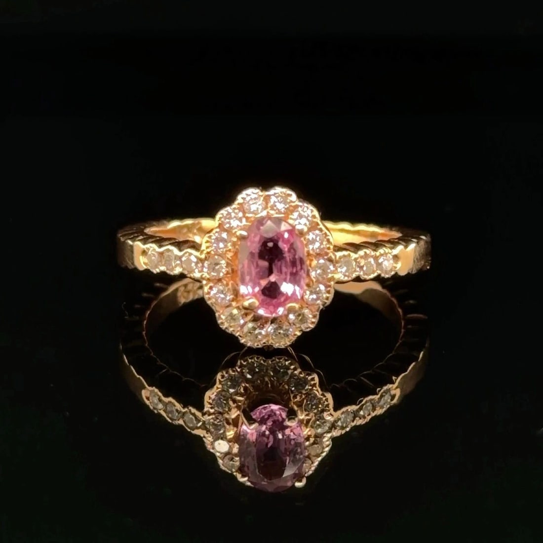 .64CT PINK SAPPHIRE AND DIAMOND RING IN 14K YELLOW GOLD: .64CT PINK SAPPHIRE AND DIAMOND RING IN 14K YELLOW GOLD Elevate your look with this stunning Unisex ring crafted in 14K yellow gold Featuring a captivating pear cut natural pink sapphire weighing 64ct