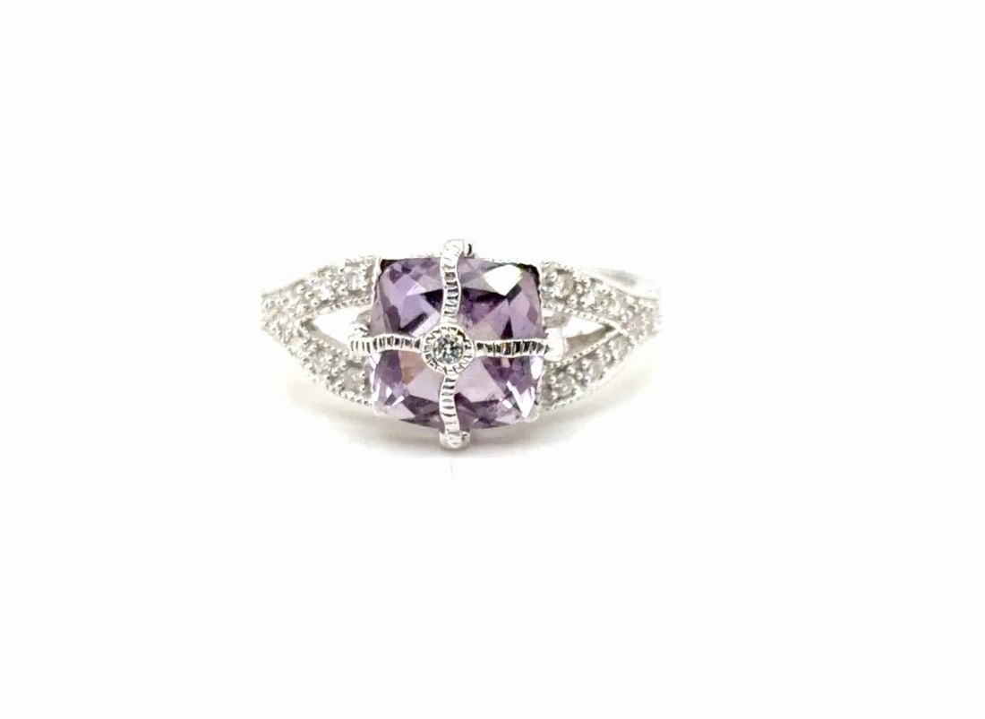 2.2CT PURPLE AMETHYST AND .30CT DIAMOND RING IN 14K WHITE GOLD: 2.2CT PURPLE AMETHYST AND .30CT DIAMOND RING IN 14K WHITE GOLD Elevate your look with this stunning Amethyst cocktail ring crafted in 14K white gold weighing 3 6g Featuring a captivating 2 2ct cushion