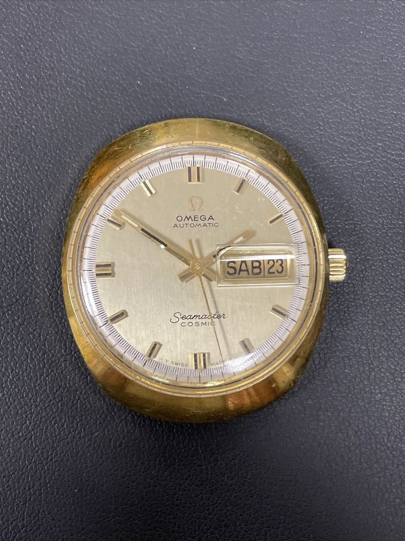 VINTAGE OMEGA SEA MASTER COSMIC AUTOMATIC GOLD PLATED STAINLESS PORTUGUESE: VINTAGE OMEGA SEA MASTER COSMIC AUTOMATIC GOLD PLATED STAINLESS PORTUGUESE This vintage Omega Seamaster Cosmic wristwatch features a beautiful gold-plated stainless steel case with a classic yet uniqu