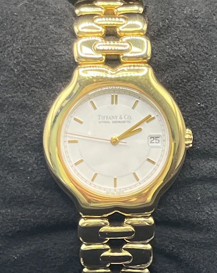TIFFANY & CO. TESORO WATCH WITH ROUND WHITE FACE 18K YELLOW GOLD (1 of 1)