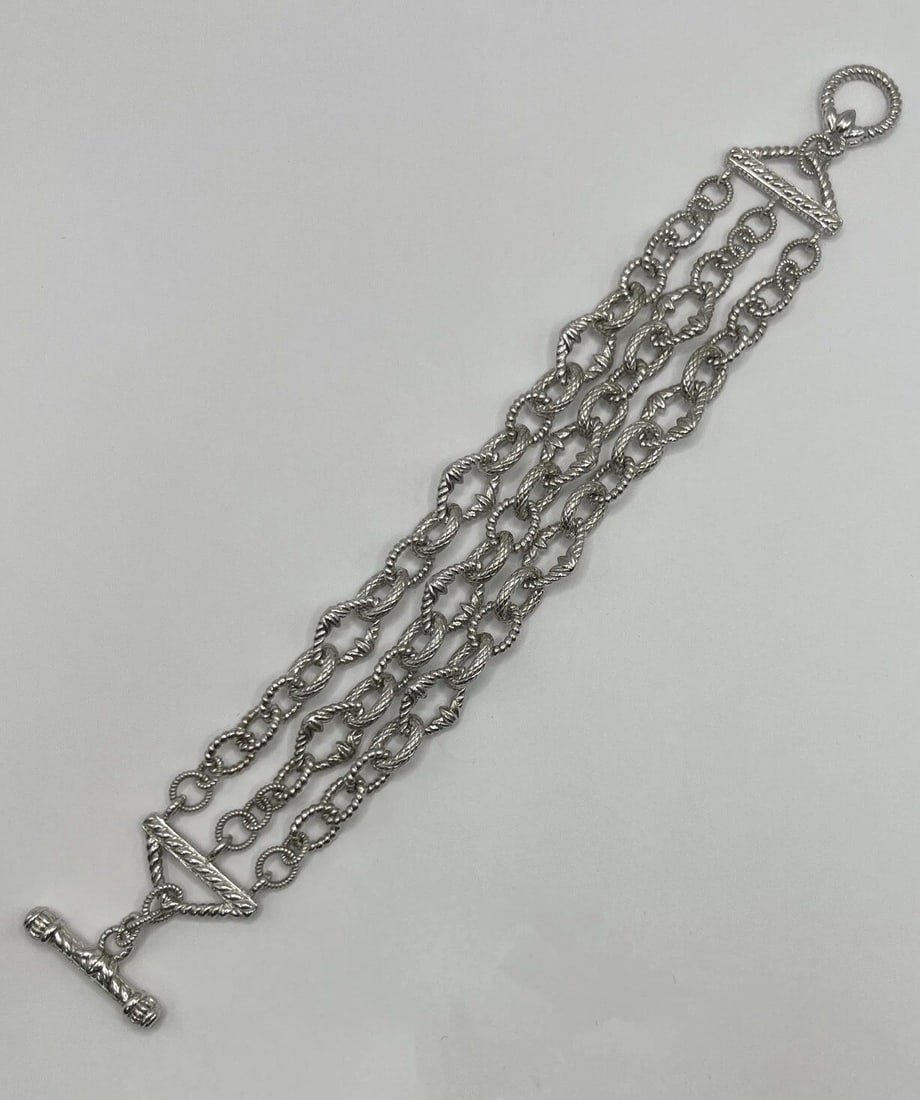 8" TRIPLE CHAIN LINK BRACELET WITH TOGGLE CLASP: 8" TRIPLE CHAIN LINK BRACELET WITH TOGGLE CLASP 8" TRIPLE CHAIN LINK BRACELET WITH TOGGLE CLASP This stunning 8 inch bracelet is a must-have accessory for any jewelry collection. With three delicate c