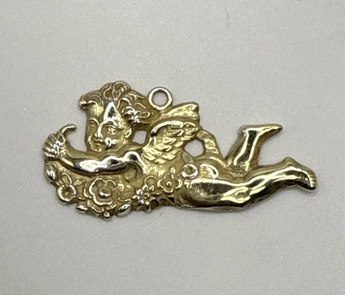 GORHAM STERLING SILVER VERMEIL ANGEL PENDANT: GORHAM STERLING SILVER VERMEIL ANGEL PENDANT The Gorham Sterling Silver Vermeil Angel Pendant is a vintage piece of fine jewelry, crafted in the United States. This pendant features an elegant design