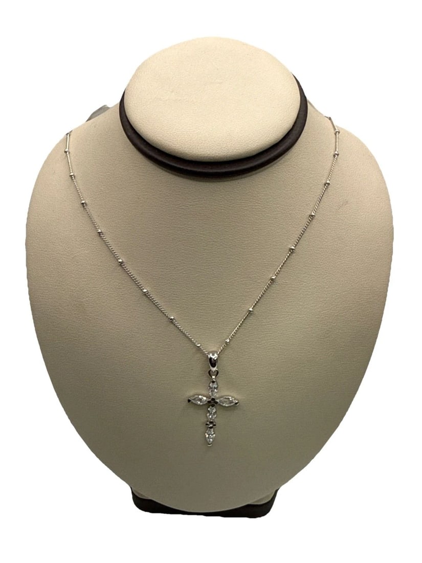 16" STERLING SILVER CHAIN WITH COLORLESS STONE CROSS The ESQ Ladies Stainless Steel Quartz Diamond: The ESQ Ladies Stainless Steel Quartz Diamond Bezel Mother of Pearl Dial Watch is a stylish and elegant timepiece designed for women. With a silver bezel and a Mother of Pearl dial featuring Arabic
