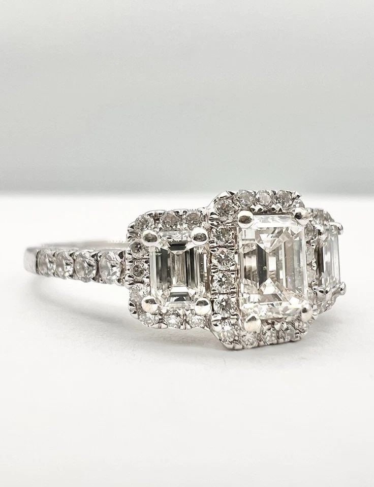 FINE PLATINUM 1.75TCW APPROX EMERALD CUT DIAMOND ENGAGEMENT WEDDING HALO RING: FINE PLATINUM 1.75TCW APPROX EMERALD CUT DIAMOND ENGAGEMENT WEDDING HALO RING Designer Platinum 1.75tcw Emerald Cut Diamond Engagement Wedding Halo Ring Size: 9.75 - Can Be Resized Metal: Platinum - T