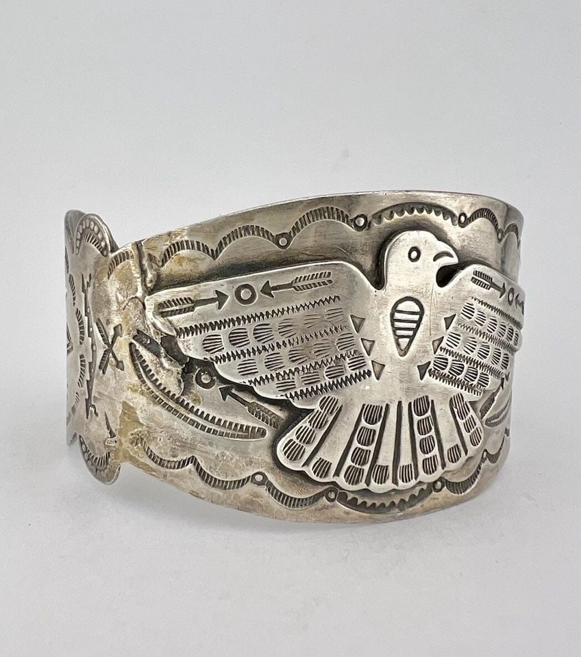 1940S FRED HARVEY NAVAJO COIN SILVER THUNDERBIRD STAMPED ARROWHEAD CUFF BRACELET: 1940S FRED HARVEY NAVAJO COIN SILVER THUNDERBIRD STAMPED ARROWHEAD CUFF BRACELET 1940's Fred Harvey Navajo Coin Silver Thunderbird Stamped Arrowhead Cuff Bracelet Cuff is 5 3/4" tip to Tip and has a 1