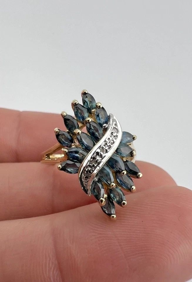 DESIGNER 10K YELLOW GOLD MARQUISE CUT BLUE SAPPHIRE & DIAMOND RING: DESIGNER 10K YELLOW GOLD MARQUISE CUT BLUE SAPPHIRE & DIAMOND RING Designer 10k Yellow Gold Marquise Cut Blue Sapphire & Diamond Ring Ring Size: 7.25 - Can Be Resized Metal: 10k Yellow Gold - Hallmark