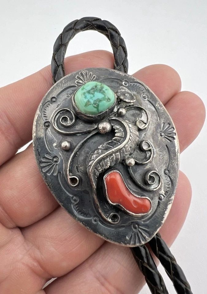 VINTAGE NAVAJO STERLING SILVER TURQUOISE & CORAL STAMPED BOLO TIE 2 1/8": VINTAGE NAVAJO STERLING SILVER TURQUOISE & CORAL STAMPED BOLO TIE 2 1/8" Vintage Navajo Sterling Silver Turquoise & Coral Stamped Bolo Tie 2 1/8" Size: 2 1/8" Tall by 1 5/8" Wide Weight is 36.0 Grams 