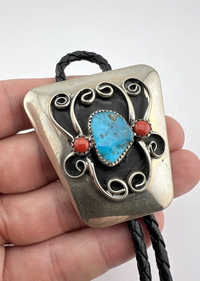 VINTAGE NAVAJO NICKEL SILVER HIGH GRADE TURQUOISE & CORAL STAMPED BOLO TIE 2": VINTAGE NAVAJO NICKEL SILVER HIGH GRADE TURQUOISE & CORAL STAMPED BOLO TIE 2" Vintage Navajo Nickel Silver High Grade Turquoise & Coral Stamped Bolo Tie 2" Size: 2" Tall by 2" Wide at The Top Weight i