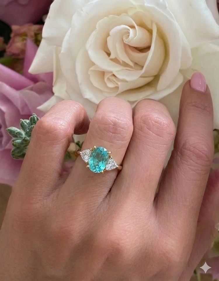 14K WHITE YELLOW GOLD ENGAGEMENT RING 2.93CT.NATURAL PARAIBA TOURMALINE OVAL CUT: 14K WHITE YELLOW GOLD ENGAGEMENT RING 2.93CT.NATURAL PARAIBA TOURMALINE OVAL CUT Gorgeous vintage ring crafted in solid 14K white and yellow gold, featuring a breathtaking natural Paraiba tourmaline a