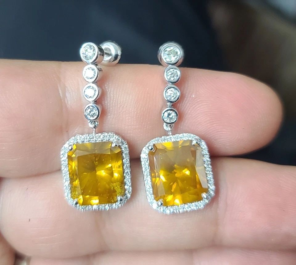 VINTAGE 14K WHITE GOLD DROP EARRINGS 15.54CT. NATURAL YELLOW DIAMOND RADIANT CUT: VINTAGE 14K WHITE GOLD DROP EARRINGS 15.54CT. NATURAL YELLOW DIAMOND RADIANT CUT Gorgeous 14K white gold drop earrings Natural treated yellow diamonds 15.54-carat total weight yellow diamonds. SI1 cla