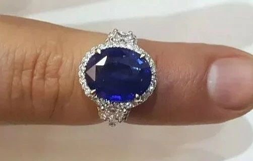 PLATINUM ENGAGEMENT RING 7.59CT. NATURAL GEM BLUE SAPPHIRE OVAL CUT: PLATINUM ENGAGEMENT RING 7.59CT. NATURAL GEM BLUE SAPPHIRE OVAL CUT Platinum sapphire ring Center stone Natural heated blue sapphire sapphire oval shape size 12.8X10.6x5.5mm weight 6.61ct. CERT. clean