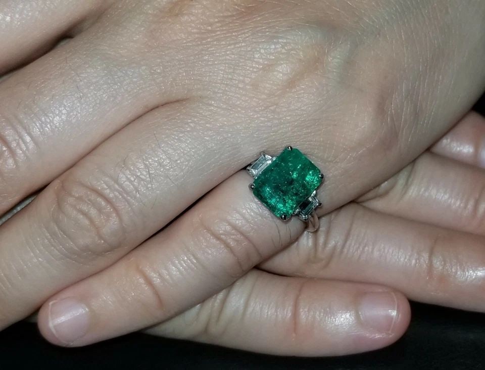 PLATINUM ENGAGEMENT THREE STONES RING 3.72CT. NATURAL GREEN COLOMBIA EMERALD: PLATINUM ENGAGEMENT THREE STONES RING 3.72CT. NATURAL GREEN COLOMBIA EMERALD Gorgeous platinum Colombia green emerald ring center gem Colombia emerald in emerald cut weight 3.72ct. C.D. Switzerland ce