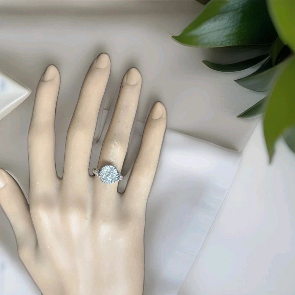 18K WHITE GOLD VINTAGE FILIGREE ENGAGEMENT RING 2.64CT. NATURAL CUSHION DIAMOND: 18K WHITE GOLD VINTAGE FILIGREE ENGAGEMENT RING 2.64CT. NATURAL CUSHION DIAMOND An exceptional Art Deco-era engagement ring, crafted in 18K white gold, showcasing timeless elegance and intricate vinta